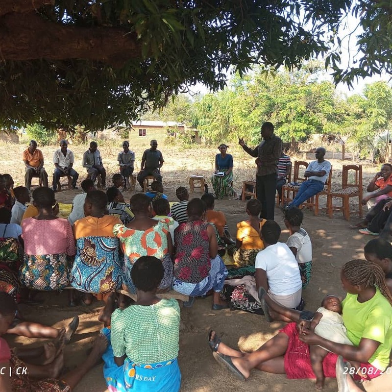 CaptionPeer educator engaging with community member on SRHR